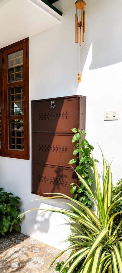 Coffee Brown 3-Door Step rack fitted on a wall beside a door